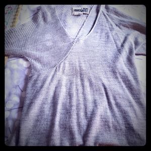 Grey knit top by Rogan.